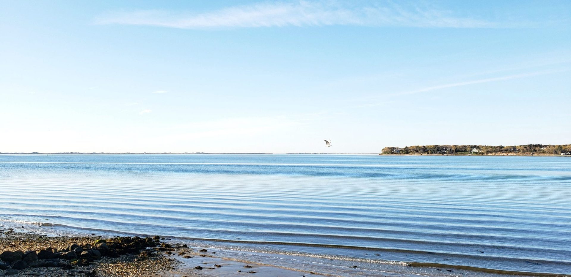 Private bay beach at Ocean View Terrace Inn with calm waters of Shinnecock Bay, Hampton Bays, NY