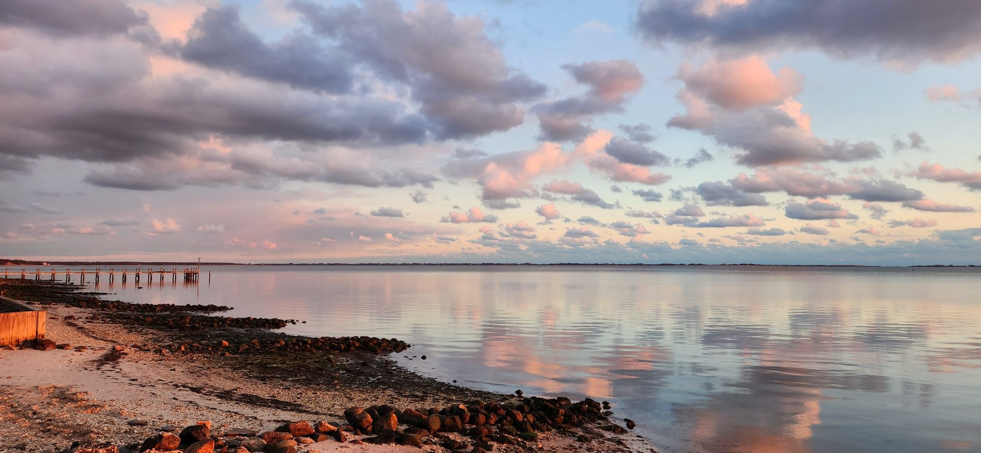 Quiet winter scene on Shinnecock Bay with moody skies and empty shoreline, Hampton Bays, NY
